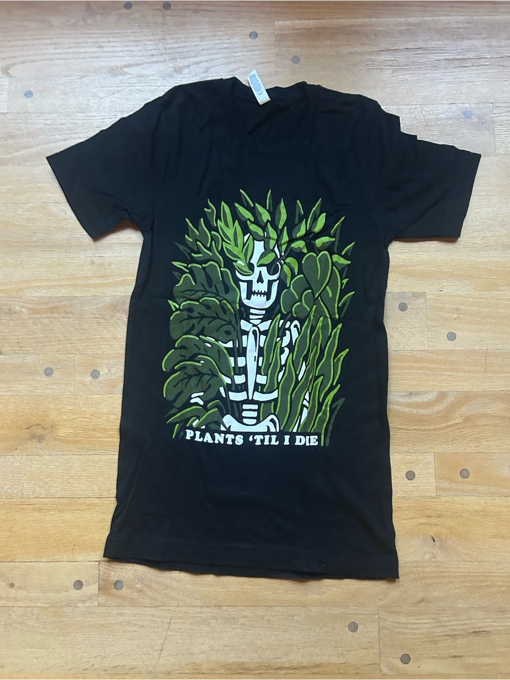 Bella Canvas Black Tee with Green Plant Skeleton Graphic